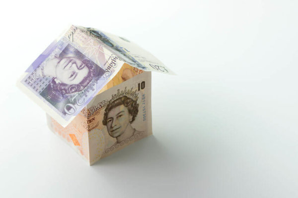 Image of a house made of bank notes as illustration for blog post 'How much do you need for 'a comfortable retirement'?'