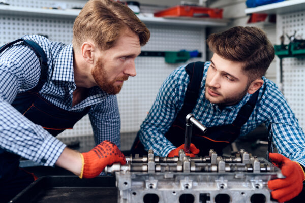 Image of two mechanics as illustration for post 'Major reforms to apprenticeships announced.'