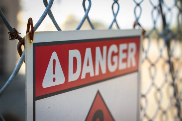 Image of 'Danger' sign on a construction site as illustration for post 'HMRC scam warning – June 2023'.