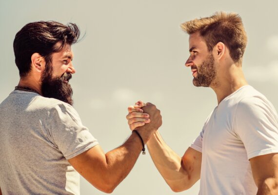 Image of two business owners shaking hands to agree a deal as illustration for post 'Close the Deal'.