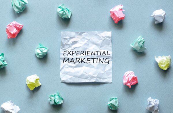 Image of screwed up balls of paper surrounding another piece with 'experiential marketing' written on it, as illustration for post 'What is Experiential Marketing?'