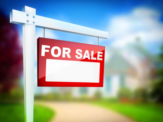 Image of a 'For Sale' board outside a property as an illustration for post 'Buying a Business? What to think about...'