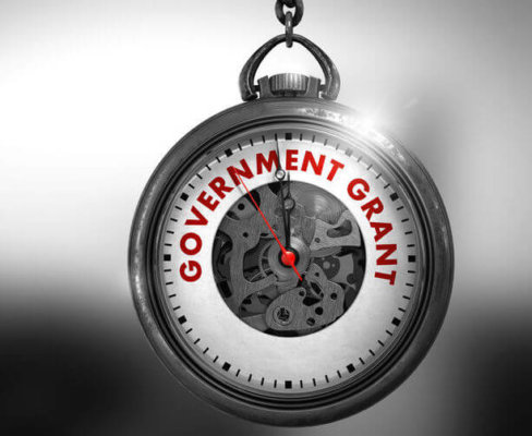 Image of a stopwatch with 'Government Grants' written across the glass, as illustration for Blog post 'Job Retention Bonus Criteria announced...'