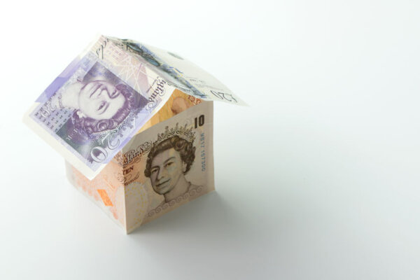 Image of bank notes balanced to create a 3D house, as illustration for post 'Use of home as office'.