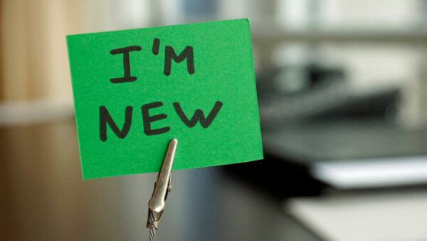 Image of a square of green paper with the words 'I'm new' written in black marker, as illustration for post 'Digital Markets, Competing and Consumers Act becomes law'.
