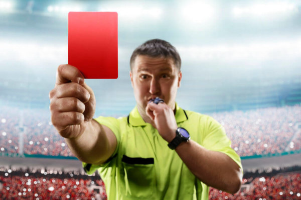 Image of a football referee with a red card as illustration for blog post 'HMRC's preferential status returns...'