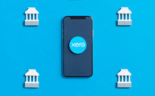 Image of Xero logo on a smart phone, with bank icons around it as illustration for post '90 Day Xero Bank Feed Authentication Update'