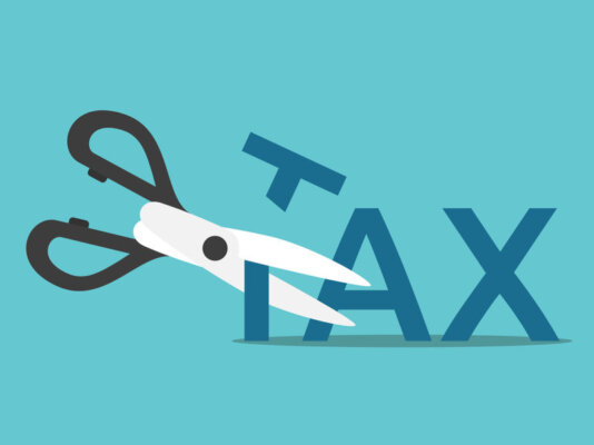 Image of scissors cutting the 'T' of 'Tax' in half, as illustration for post 'Spring Budget 2024 – National Insurance cuts: A Self Employed business perspective.'