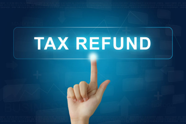 Image of a digital sign saying 'tax refund' as illustration for post '500,000 tax refunds delayed...'