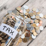 Image of coins in a jar marked 'Tax' as illustration for blog post 'Changes to SME monthly tax payments?'
