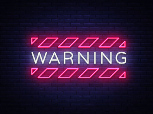 Image of neon sign saying 'Warning' as illustration for Blog post 'HMRC Issues Scam Warning'
