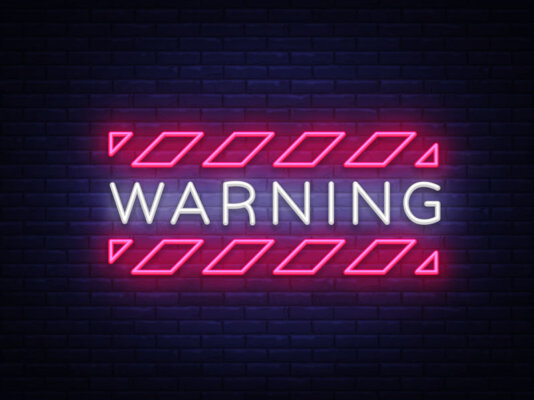 Image of a neon sign saying 'warning' as illustration for post 'Companies House Filing Fees are changing!'