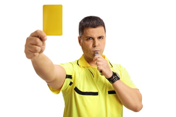 Image of a football referee with a yellow card as illustration for post 'New VAT Penalty Framework takes effect'