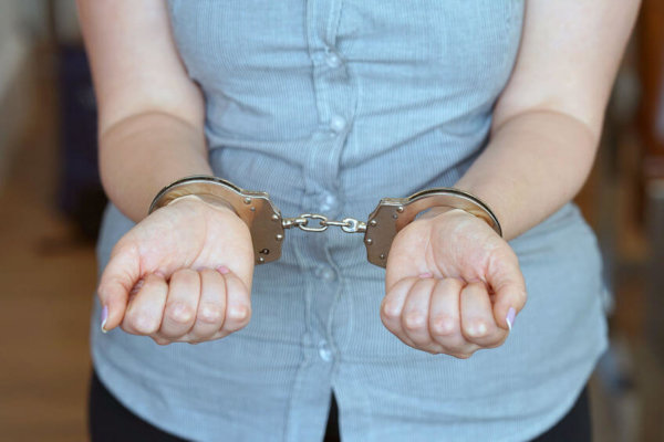 Image of person in handcuffs as illustration for Blog Post 'Furlough Fraud Arrest reported...'
