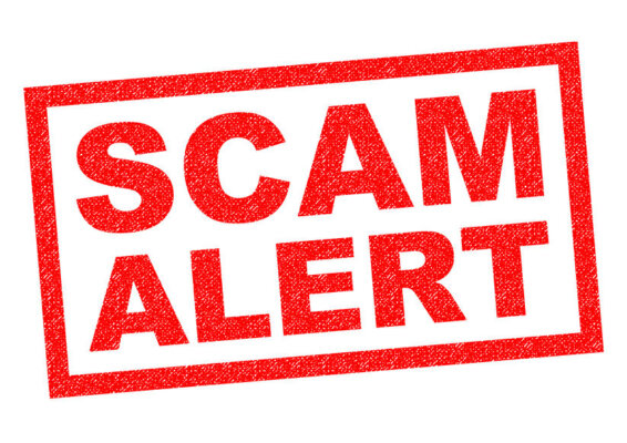 An image of the words 'SCAM ALERT' in large capital stamped in red ink on a white background as illustration for post 'Be wary of Self Assessment scams'.