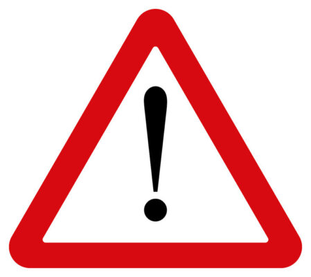 Image of a warning road sign as illustration for post 'HMRC texts scheme to reduce call wait times'.