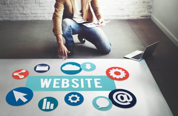 Image of a web developer with various design elements as illustration for post '15 ways to improve your website'.